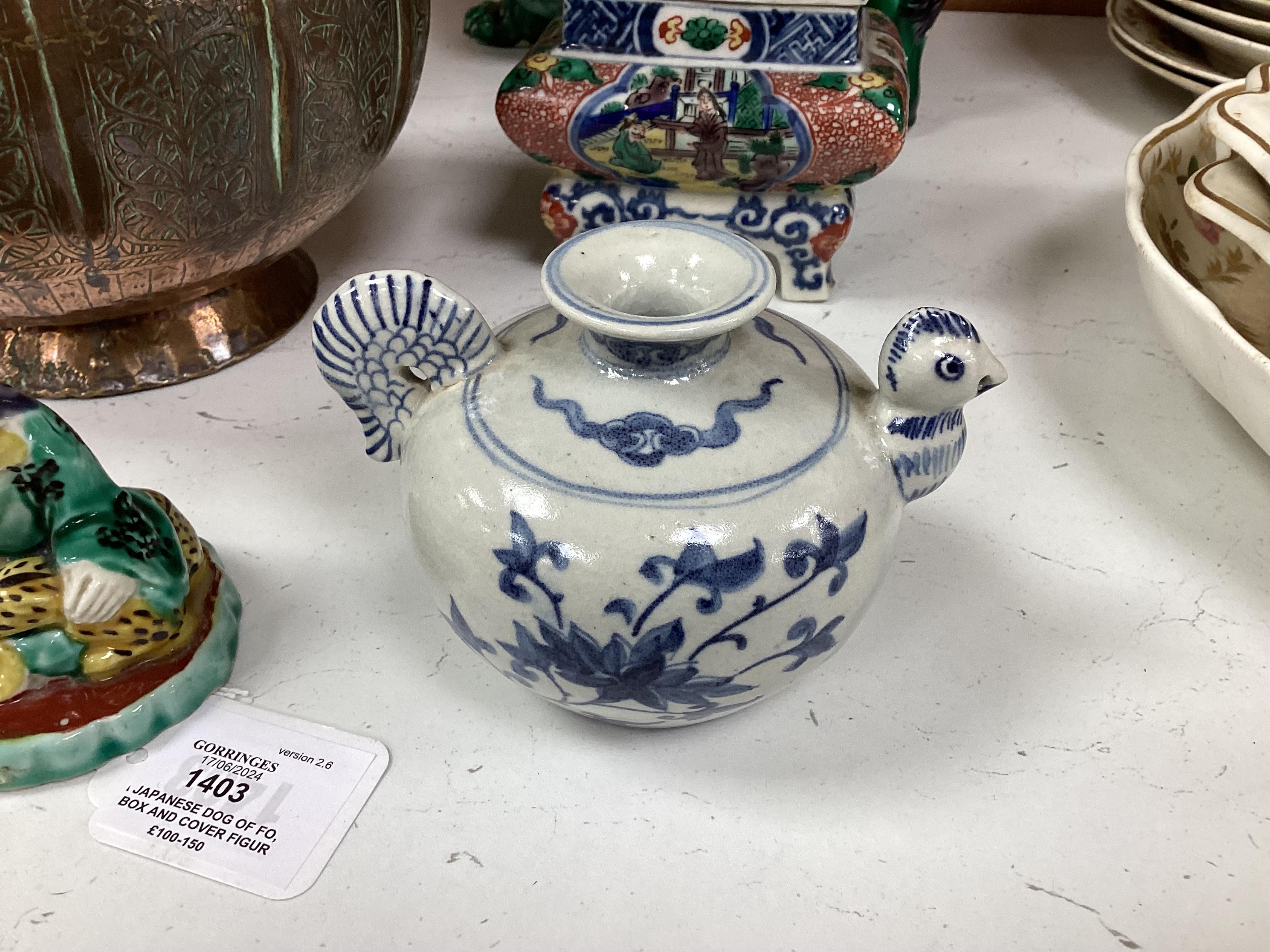 A Japanese Dog of Fo, a box and cover figure and blue and white pourer, Dog of Fo, 25cm high